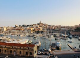 white boats at a dock